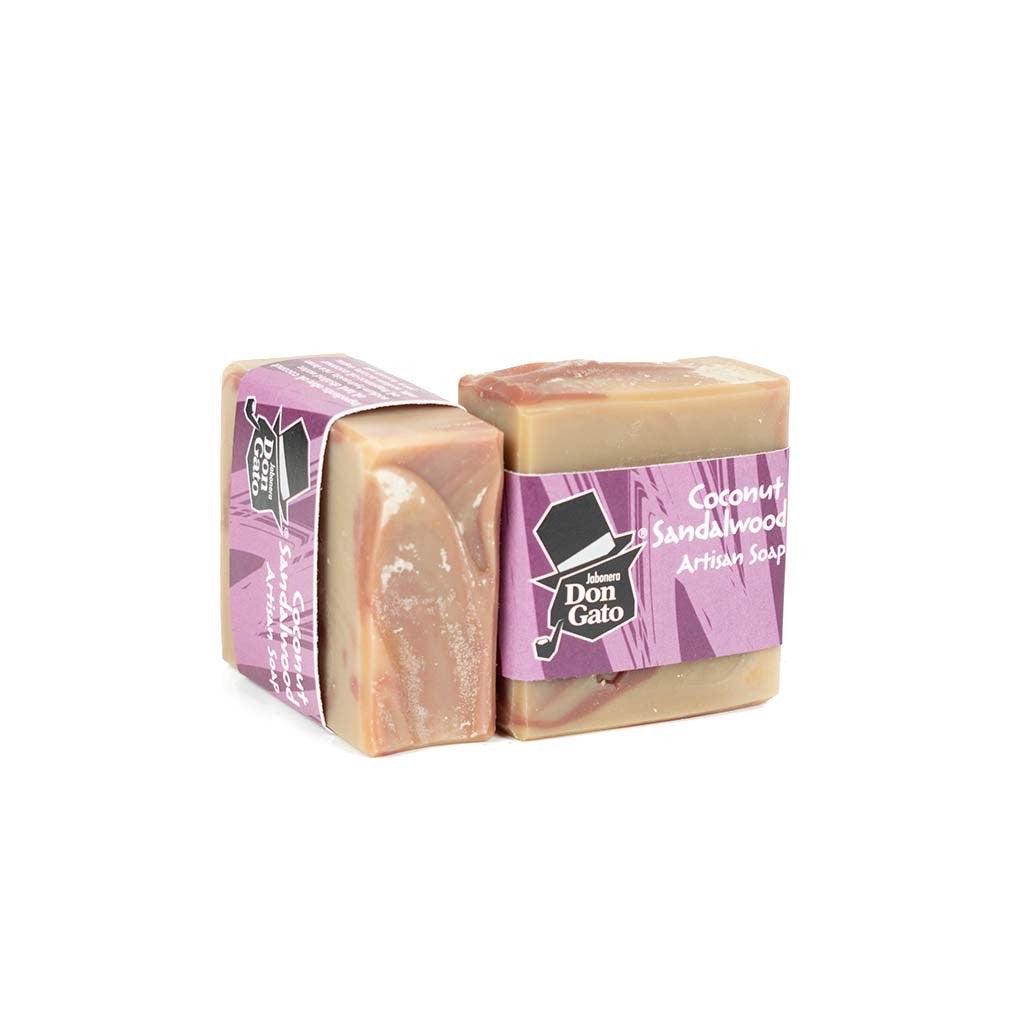 Coconut Sandalwood artisan soap by Jabonera Don Gato from the Bestsellers collection, wrapped in purple label with brand logo and warm brown tones on white background.