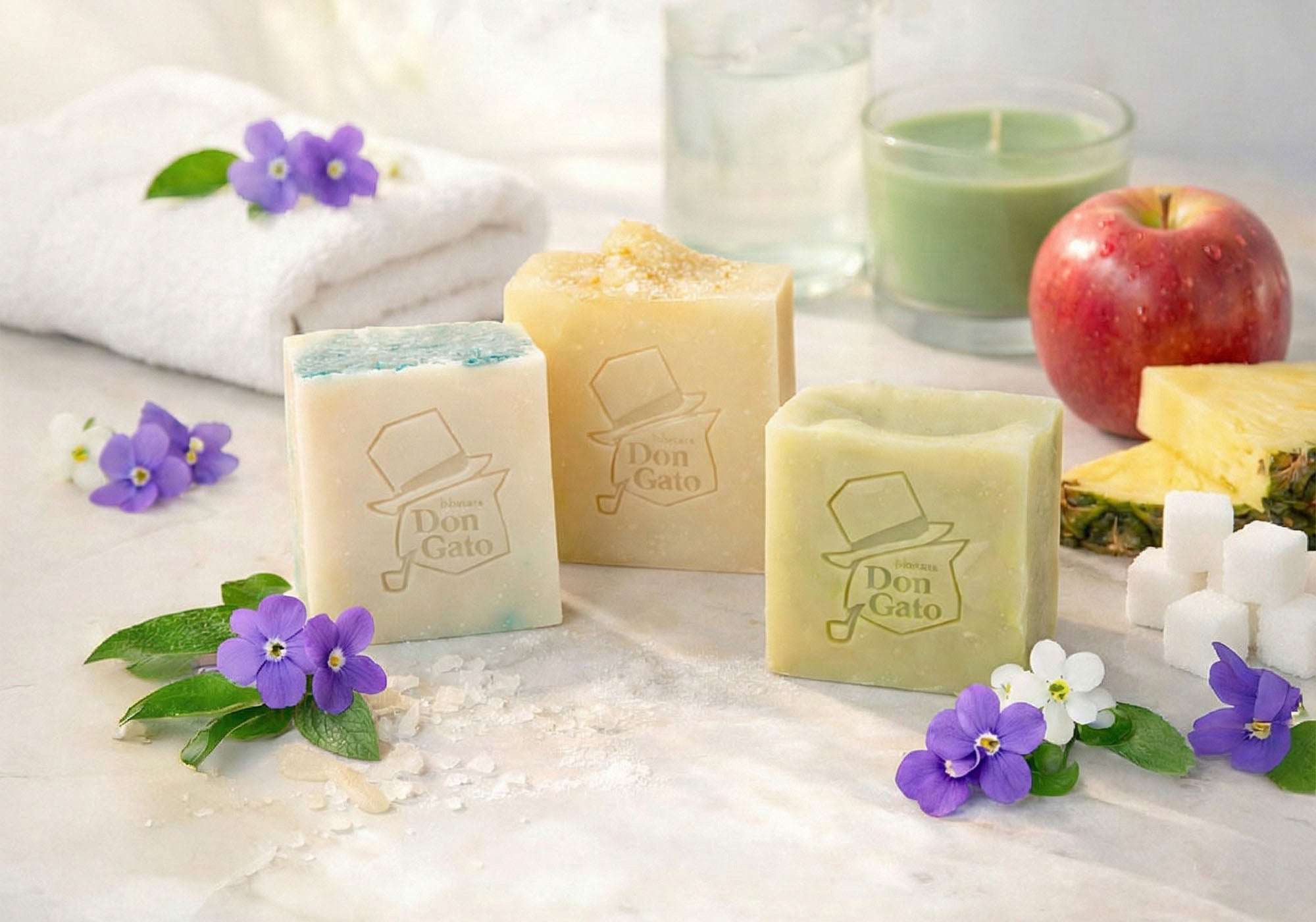 Selection of artisan soaps from the Fresh Start monthly collection by Don Gato Soap Co., styled with botanicals and photographed in bright natural light.