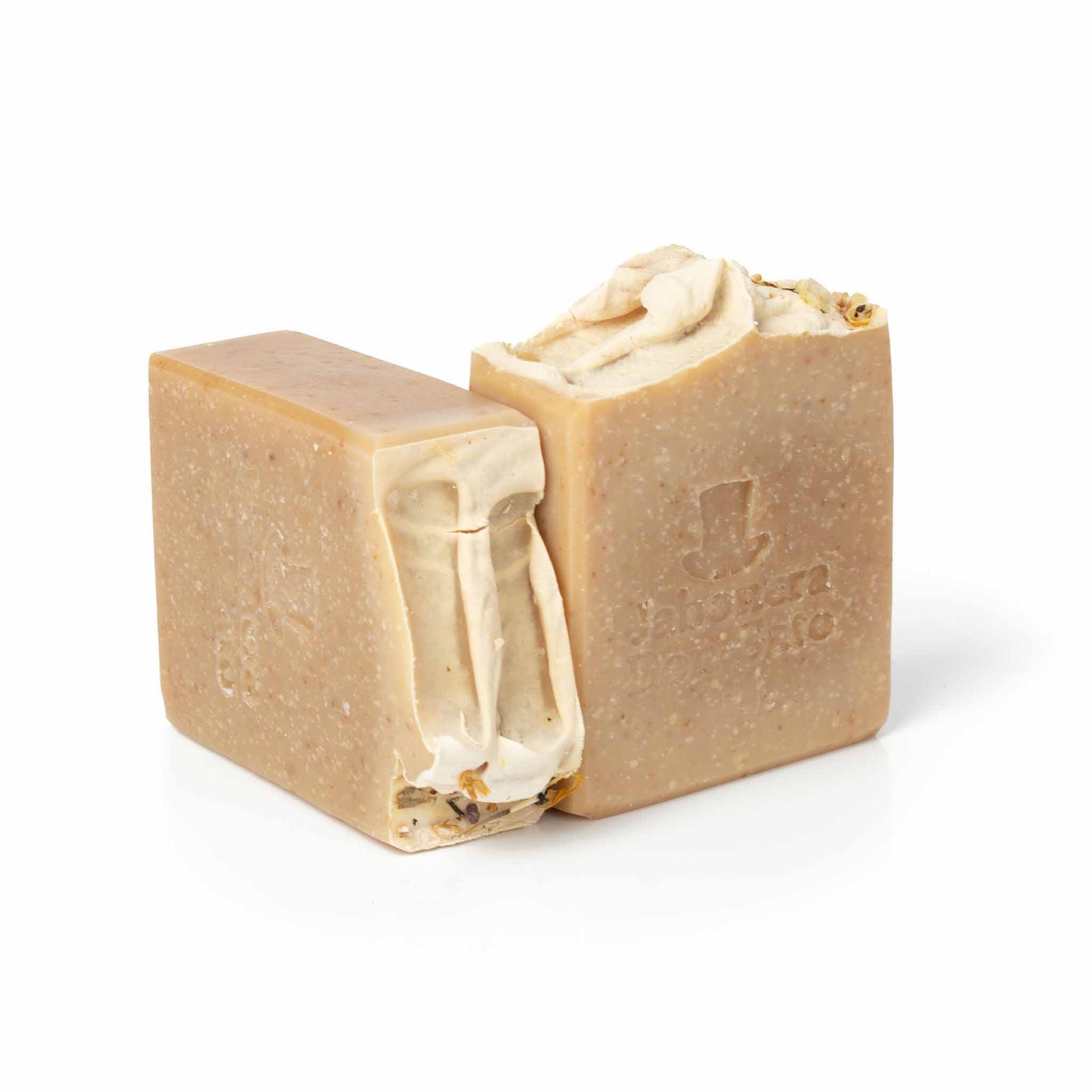 Two bars of Almond Artisan Soap, each with a rich, creamy texture and warm, inviting hue, elegantly displayed against a pristine white background, highlighting the luxurious and nourishing qualities of the handmade soap.