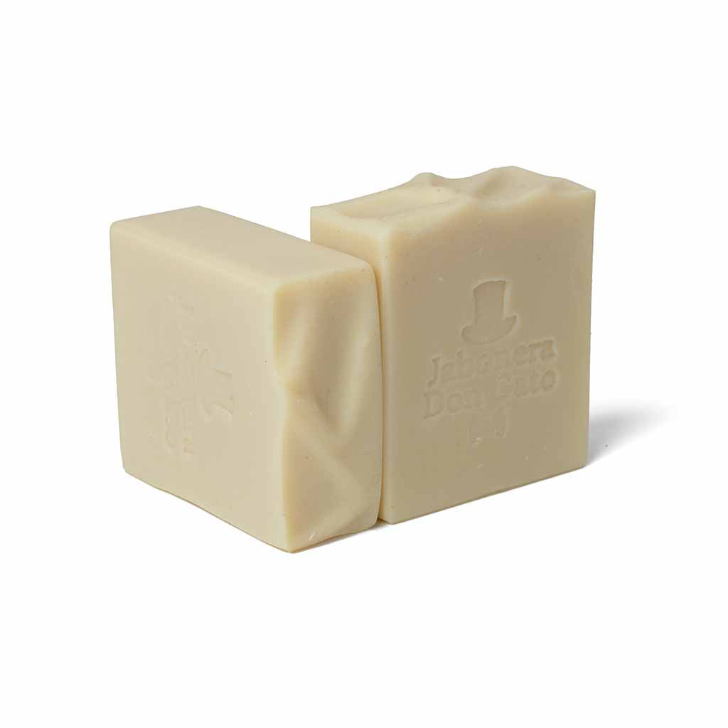 Unscented natural soap bar in creamy ivory with Don Gato logo, fragrance-free.