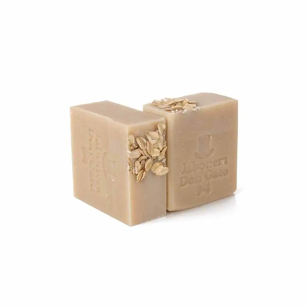 Two Oatmeal Artisan Soap bars, presented with a natural texture, placed over a crisp white background, highlighting the pure and handcrafted quality of the oatmeal-infused cleansing bars.