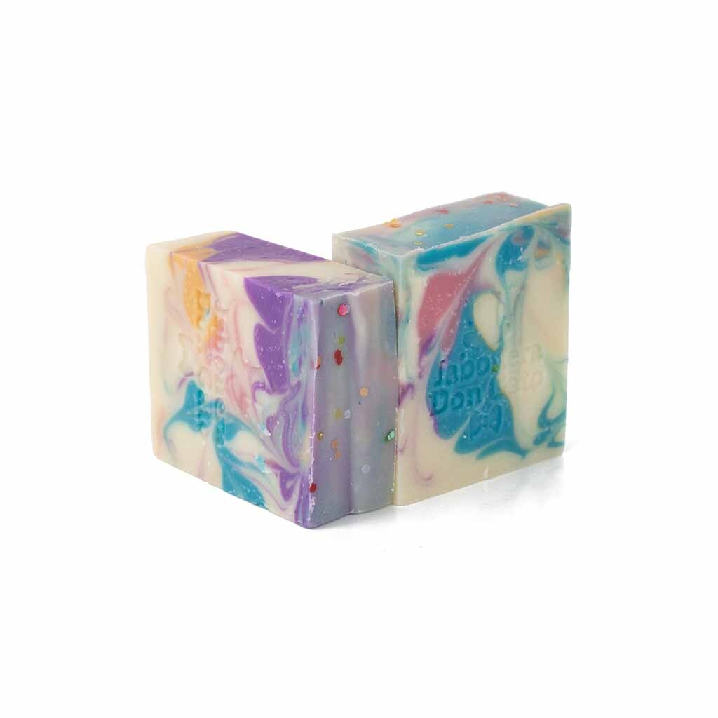 Our Carnival Artisan Soap is scented with a skin safe blueberry mint fragrance oils. It has the following colors: teal, yellow, purple and pink.
