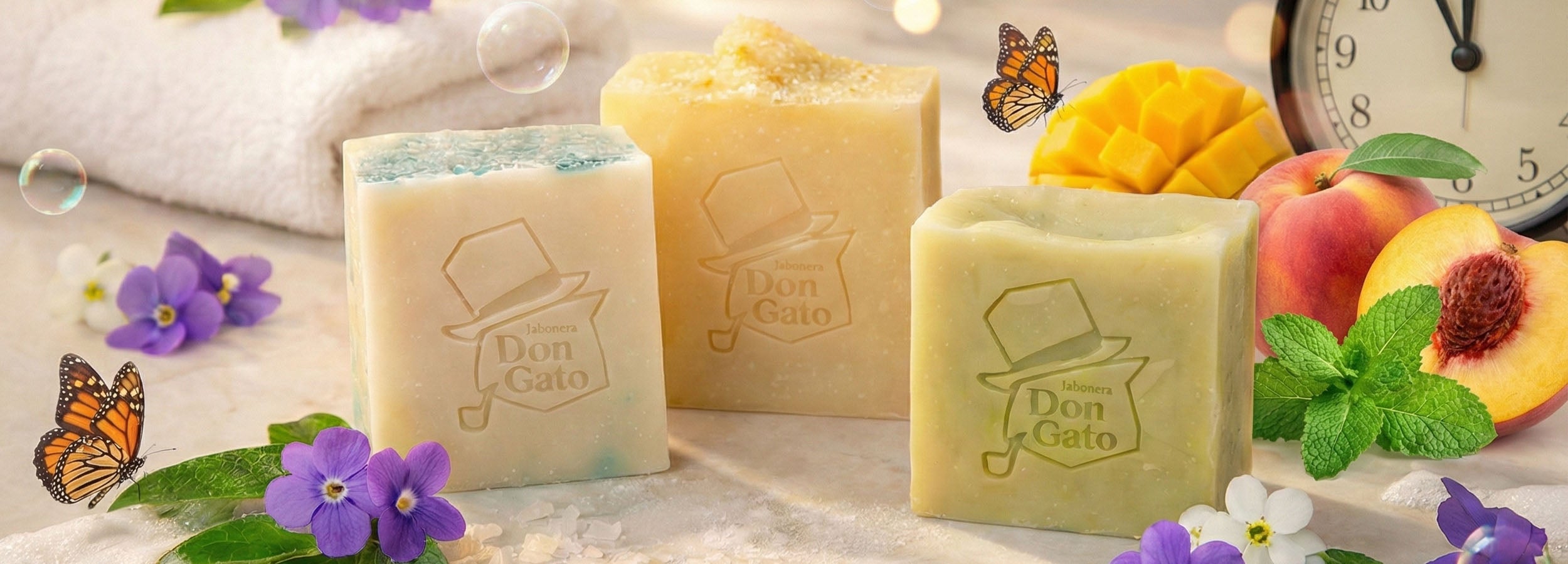 Selection of artisan soap bars from the Don Gato Soap Co. subscription, styled with botanicals and photographed in bright natural light.

