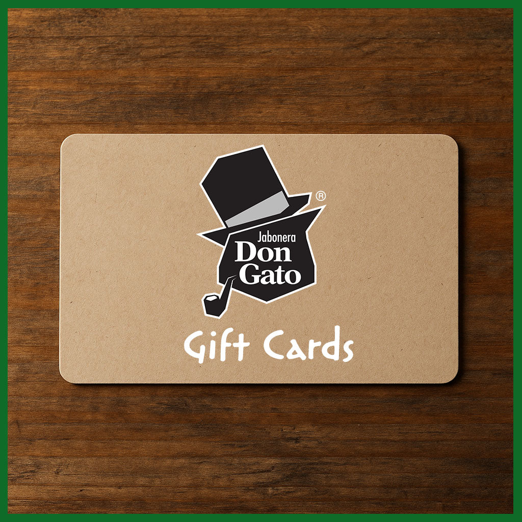Jabonera Don Gato Gift Card with top hat logo on kraft paper, wooden background.